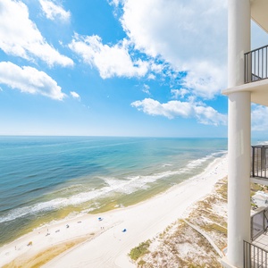 Breathtaking views of the beach and sparkling water from the spacious private balcony, perfect for relaxation and enjoyment