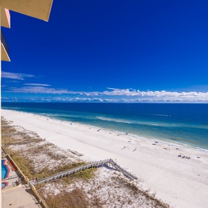 Relax with the views of the serene beach and vibrant blue waters from a spacious balcony, perfect for relaxation