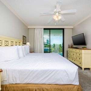 Retreat to the king master suite with cozy bedding and drift off to coastal sights and sounds of the bay