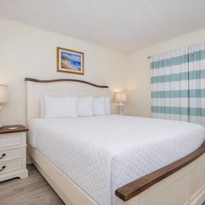 Drift into relaxation in the queen master suite, surrounded by soothing decor and gentle lighting for a peaceful getaway