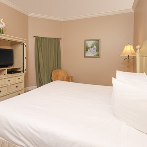 Relax on the cozy king bed in this guest suite and stream your favorite shows after a beach day