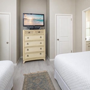 Unwind after a day at the beach with your favorite show in this cozy queen guest suite