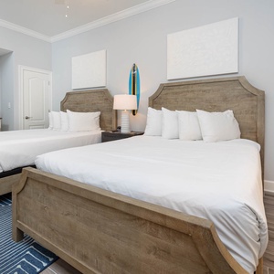 Stretch out on the roomy queen beds in this guest room and admire the surfboard wall art and coastal accents