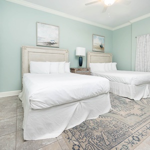 Rest comfortably in this queen guest suite, where soft bedding invites you to relax and recharge after a day at the coast