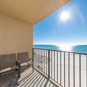 Bask in the sun on the balcony with comfortable seating and expansive views of the sparkling water and shoreline