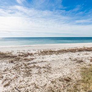 Gaze at the tranquil waters and shoreline from your spacious outdoor area, perfect for relaxation and enjoyment