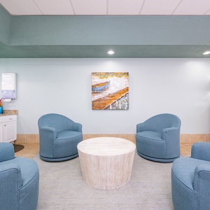 Relax in this inviting lounge with beach views, comfortable seating, and a cozy atmosphere perfect for unwinding