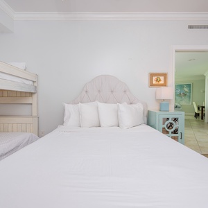 Relax on the plush double bed, surrounded by soft pillows, and unwind after a day of adventure