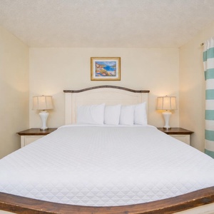 Enjoy a peaceful night in the master suite, embraced by soft bedding and gentle lighting for a relaxing getaway