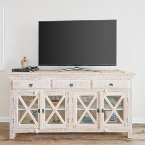 Unwind while streaming your favorite shows on the sleek TV, surrounded by charming coastal decor