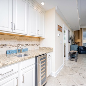 Grab a chilled bottle from the wine cooler or create your favorite cocktail at this elegant wet bar