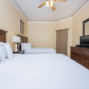 Experience cozy nights in this inviting guest bedroom, with plush queen bedding and soothing decor for ultimate relaxation