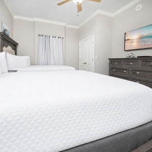 Unwind in this queen guest suite and stream your favorite shows or enjoy a good movie after a beach day