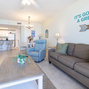 Inviting living area with comfortable seating, cheerful decor, and easy access to the dining space