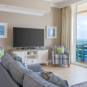 Relax in the family room, streaming your favorite shows while enjoying the refreshing coastal breeze from the balcony