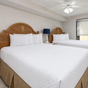 Retreat to this guest suite with two queens for a restful night and refreshing morning
