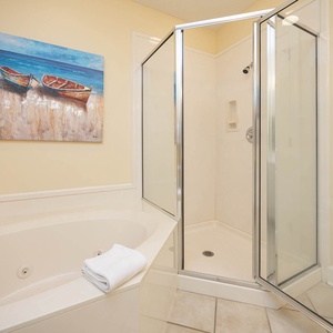 Indulge in relaxation in the master bath with a refreshing walk-in shower and soothing jetted tub