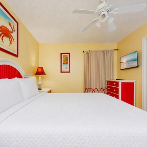 Enjoy cozy relaxation in the king suite, surrounded by cheerful decor that enhances your beach getaway