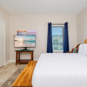 Rest in this cozy guest suite, watching your favorite shows on the TV while enjoying the serene coastal decor