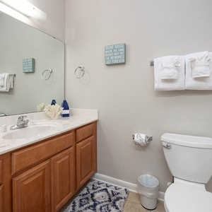 Refresh in this guest bathroom featuring a spacious vanity, soft towels, and a relaxing tub-shower combo