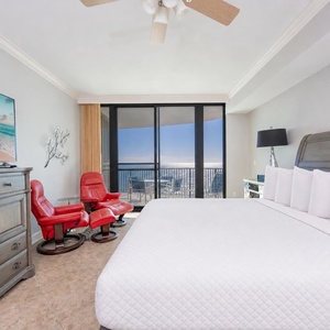 In the king master suite, unwind with your favorite show while beach reflections sparkle beyond the balcony