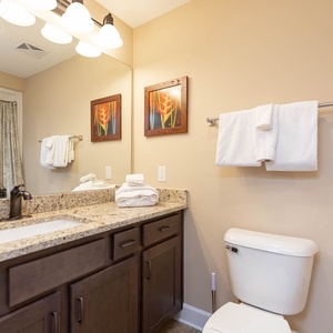 Freshen up in this guest bath in the relaxing shower or soothing tub before an exciting beach day
