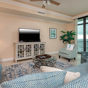 Relax in the inviting living room, where streaming your favorite shows complements the stunning coastal views