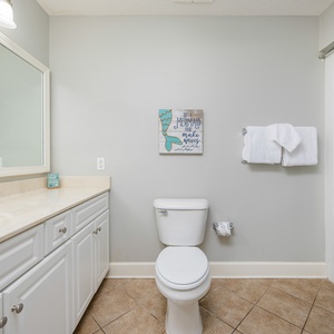 Experience rejuvenation in this guest bath, enjoying the luxury of a soothing shower