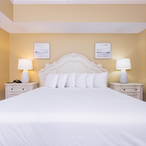 Unwind after a day at the beach in this elegant king master suite surrounded by stylish coastal accents