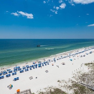 Gaze at the vibrant beach scene from your balcony and discover the pirate ship that strolls along the coast