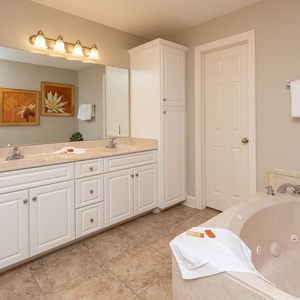 Refresh in the master bath after a day at the beach with a soothing jetted tub and relaxing walk-in shower