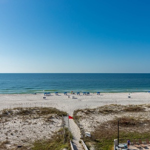 Enjoy breathtaking beachfront views from this inviting balcony, perfect for relaxing and soaking in the coastal scenery