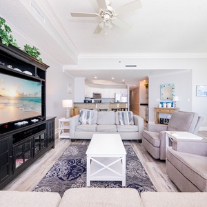 Kick back on the plush sofas with your favorite shows playing in the background and stunning beach views