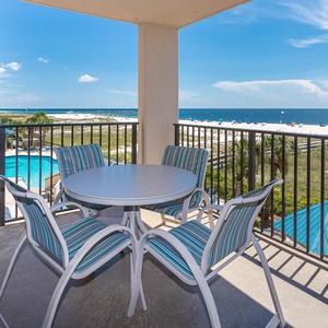 Enjoy meals or morning coffee on the balcony with views of the pool and shoreline