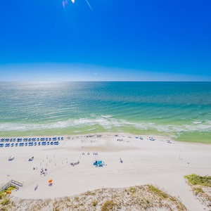 Breathtaking beach view with colorful umbrellas lining the shore, inviting guests to relax and enjoy the sun