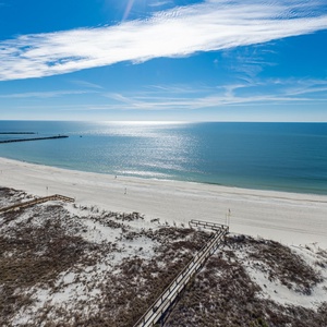 Enjoy breathtaking views from your balcony, overlooking the stunning beach and pristine waters