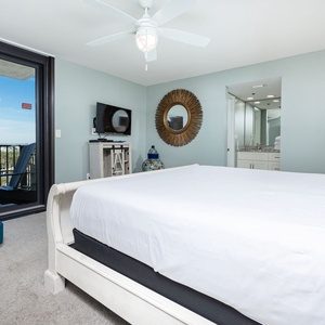 Inviting master bedroom featuring a king bed, stylish decor, and an area view from the master balcony
