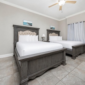 Experience restful nights in this queen guest suite, surrounded by serene decor and a soothing beach vibe