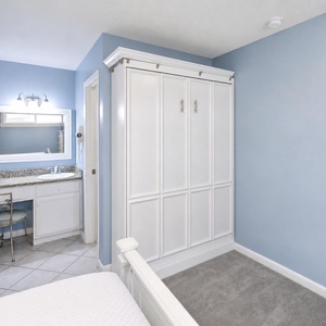 The master suite also features a fold-down queen murphy bed for additional sleeping arrangements
