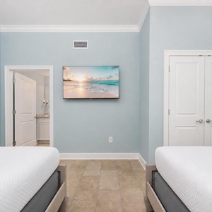 Relax in this tranquil bedroom with two queen beds and your favorite shows for a restful stay