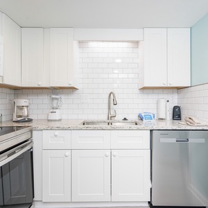 Craft memorable family moments while preparing meals in this inviting kitchen, designed for your coastal getaway