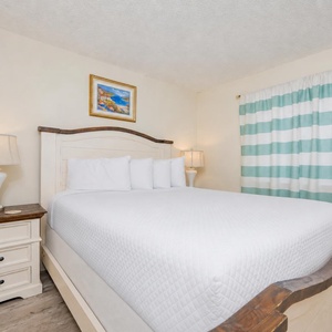 Drift into relaxation in the queen master suite, surrounded by soothing decor and gentle lighting for a peaceful getaway