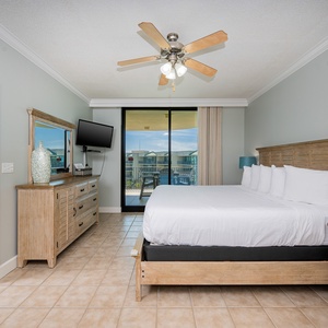 Retreat to the king master suite with cozy bedding and drift off to coastal sights and sounds of the bay