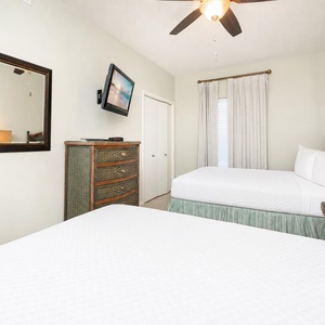 Enjoy a peaceful slumber in the queen guest suite, where plush bedding cradles you in comfort and relaxation