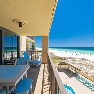 Cool coastal breeze drifts past your balcony while lounge chairs invite you to pause and relax in the sun