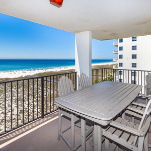 Outdoor dining table seats six as you listen to gentle waves and watch boats glide along the shore