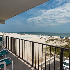 Enjoy breathtaking beach views from the balcony, complete with comfortable seating for relaxation and sunbathing