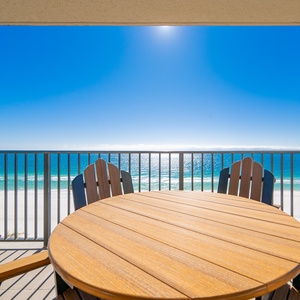 Savor meals at the outdoor table while enjoying the expansive views of the sparkling waters and coastline