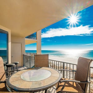 Enjoy meals or drinks at the round table while soaking in the expansive beach views from your outdoor seating area