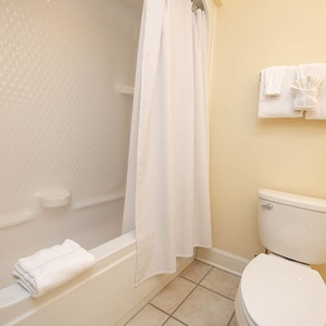 Refresh in the guest bathroom, where fluffy towels and a relaxing soak await your enjoyment after a fun day